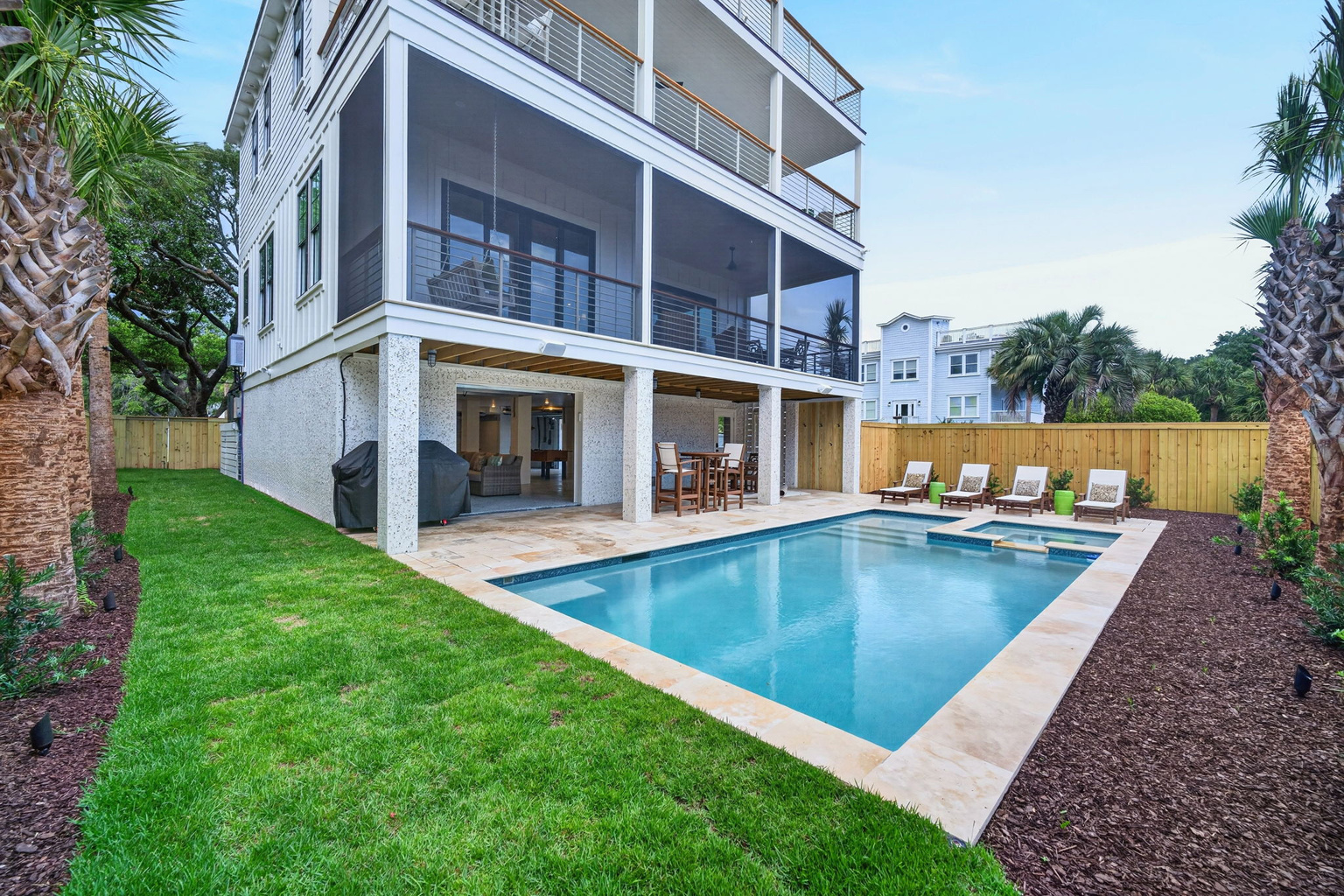Tahanan Palms exterior, private heated pool, and backyard on Isle of Palms